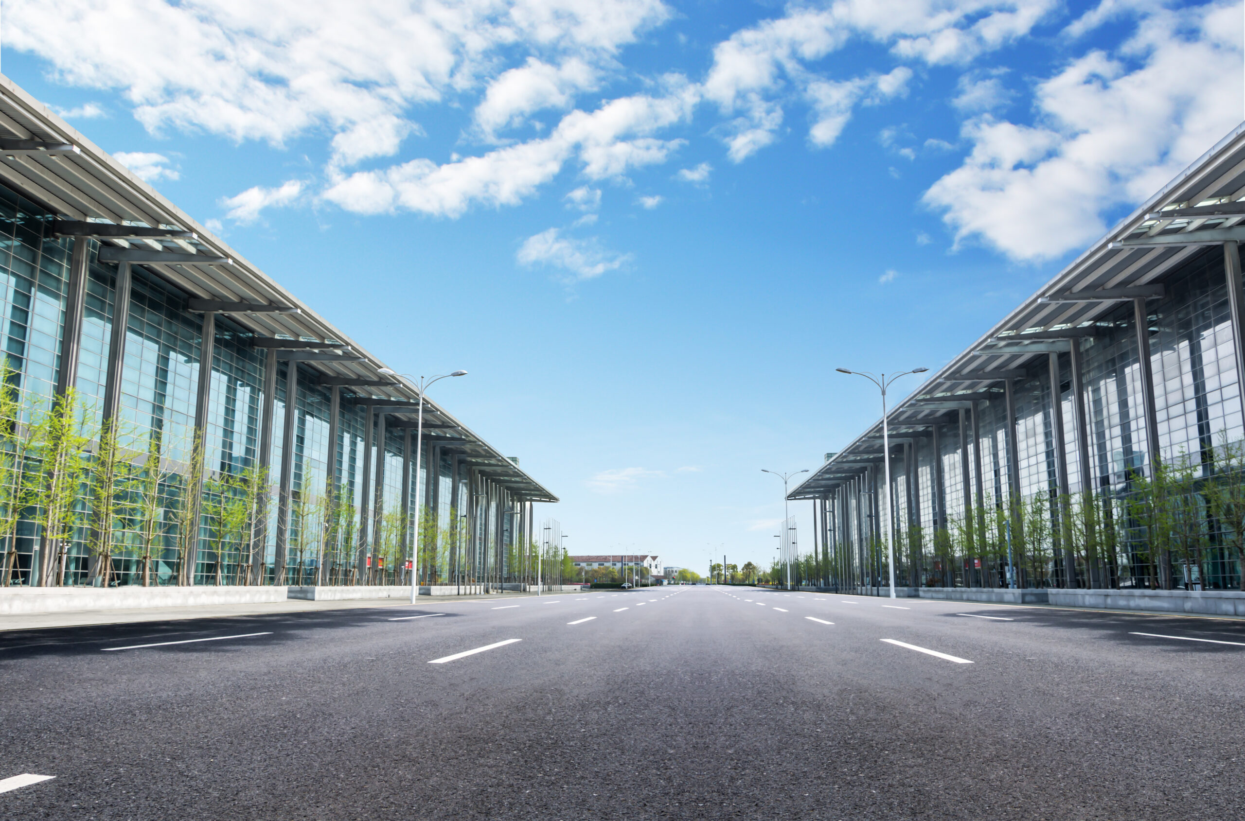 Panoramic skyline and buildings with empty road